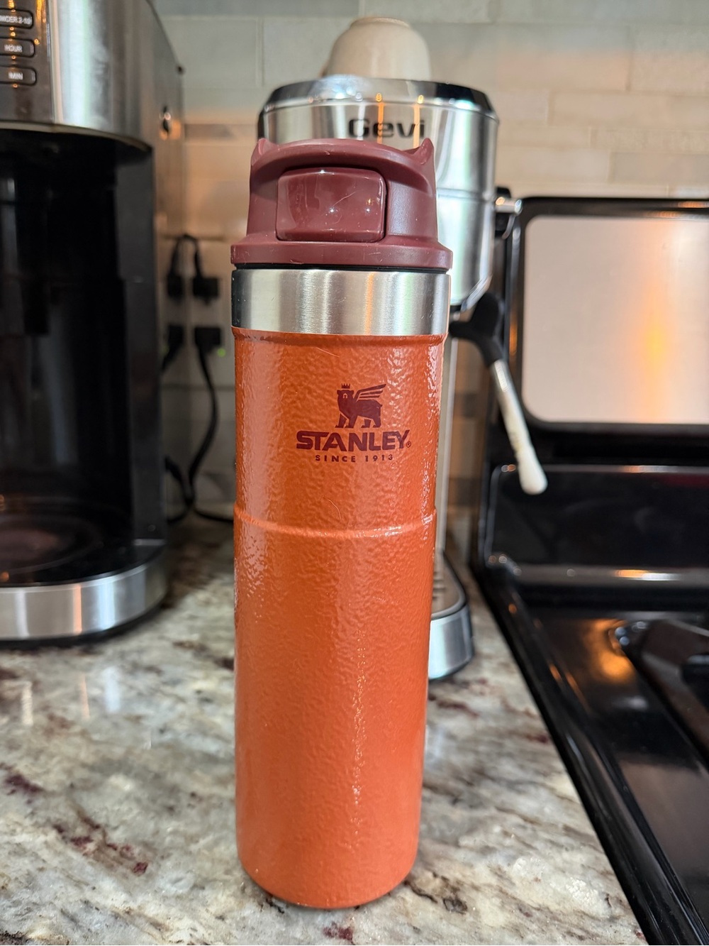 Stanley Orange Insulated Bottle with Maroon Lid